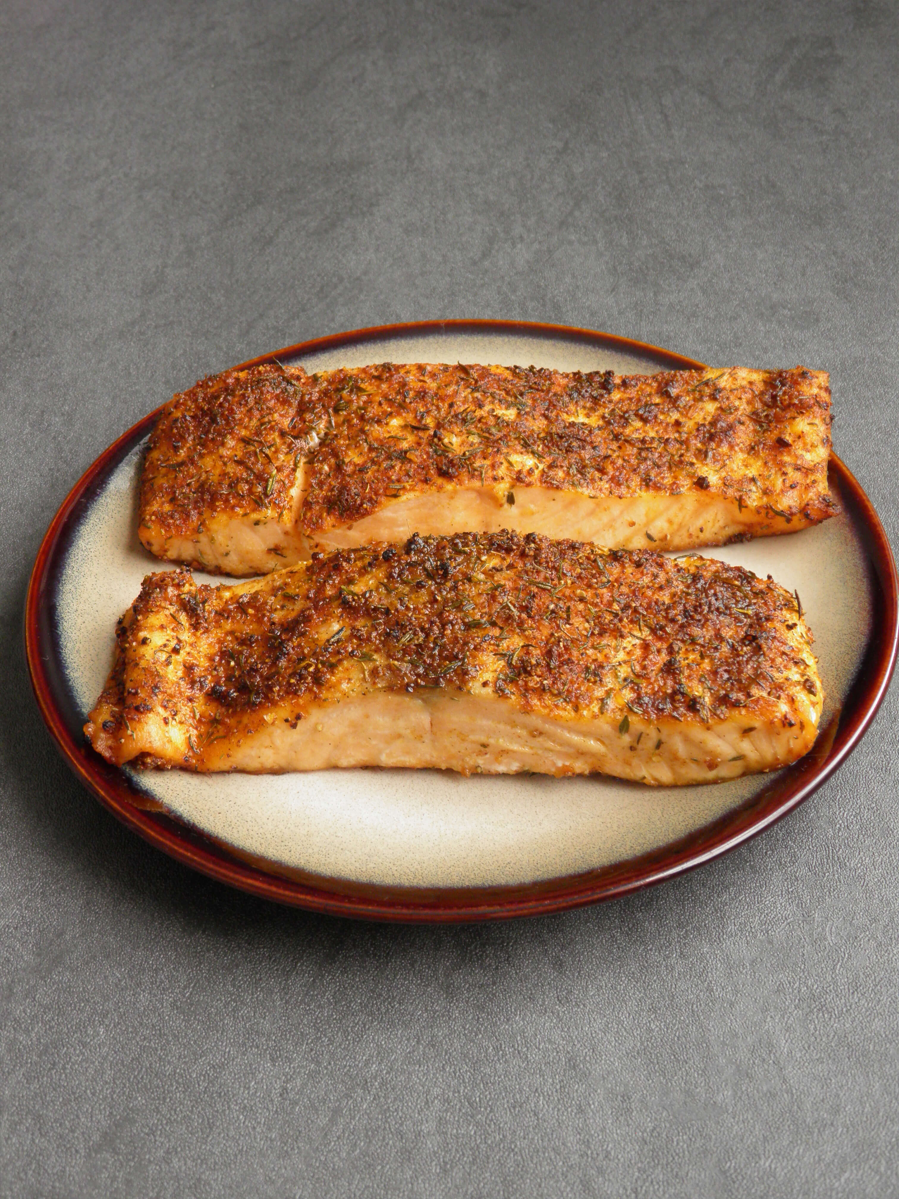 two herb crusted salmon filets on a plate