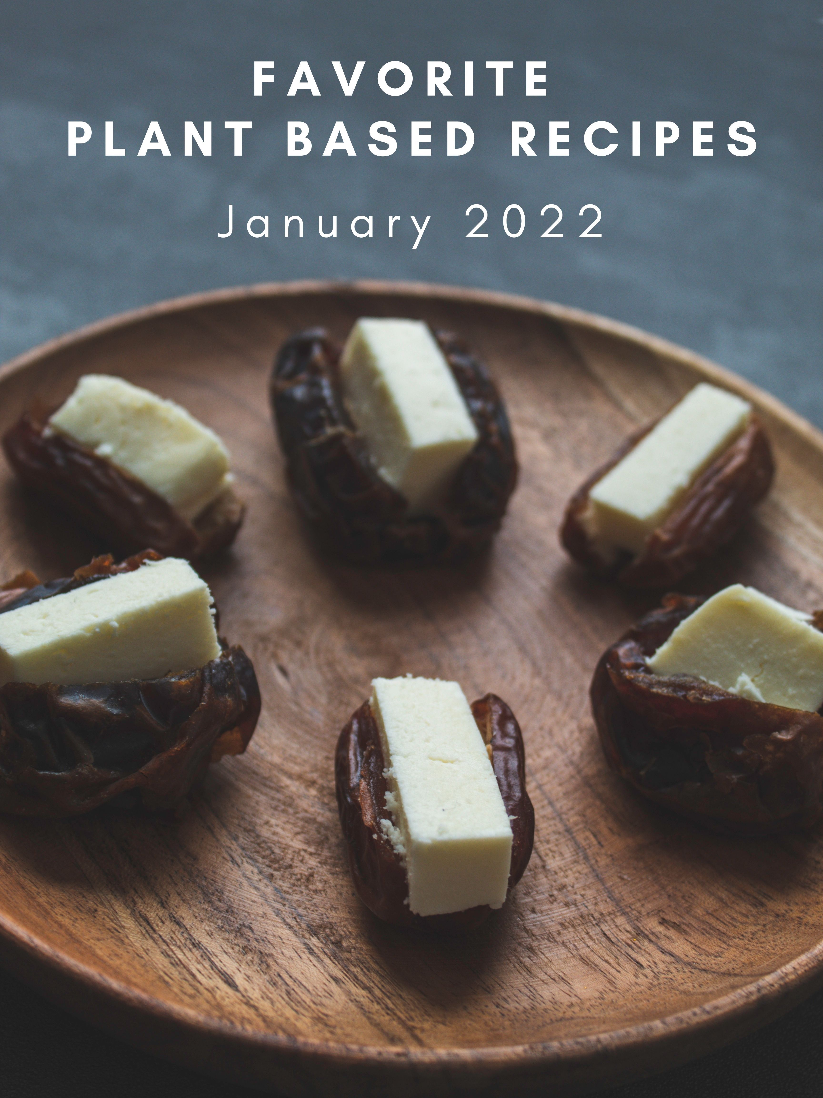 wooden plate with 6 cheese stuffed dates and title of favorite plant based recipes