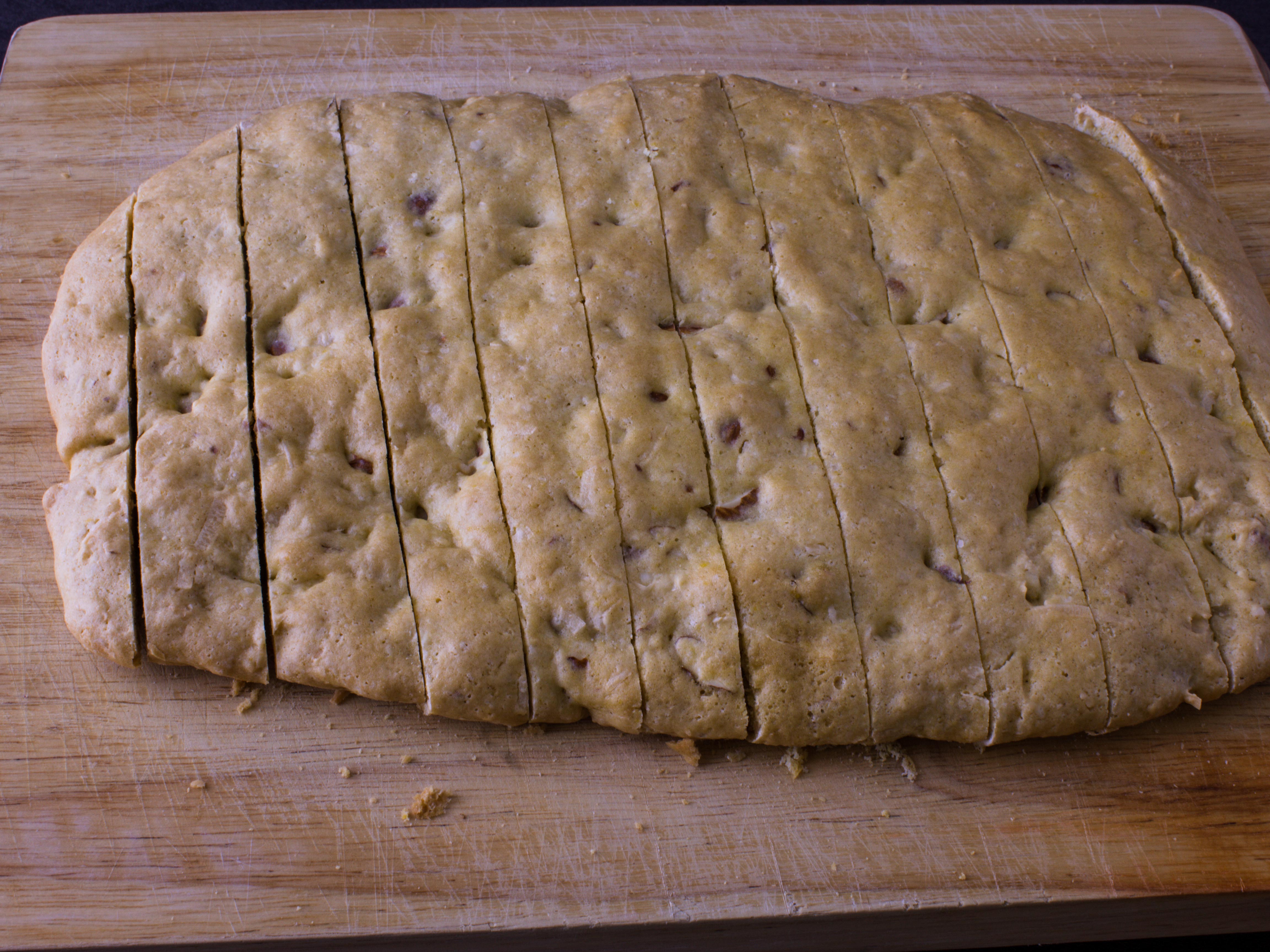 coconut biscotti dough that has cooled down and is in 1 inch slices