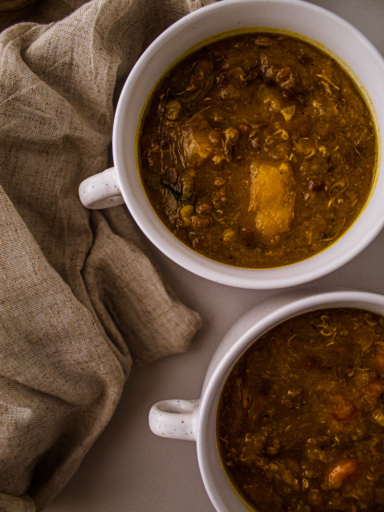 two white bowls of sprouted lentil soup
